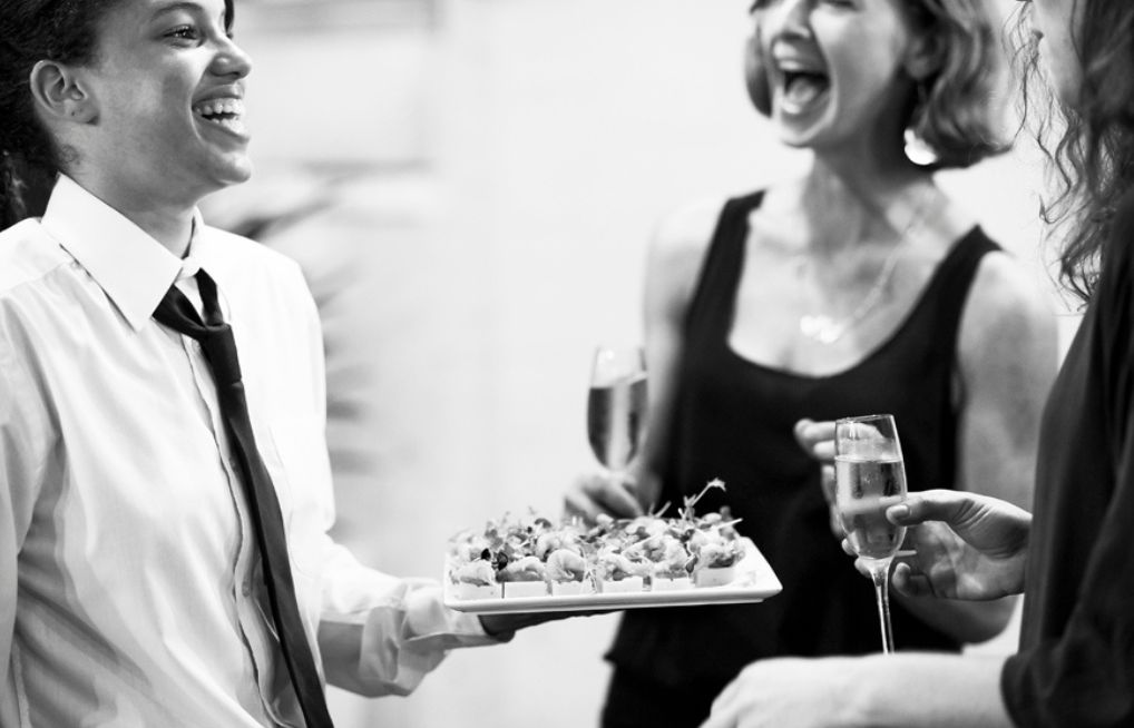 Waiter Serving canapes to guests at a cocktail function